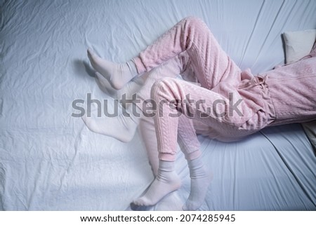 African American Woman With RLS - Restless Legs Syndrome. Sleeping In Bed Royalty-Free Stock Photo #2074285945