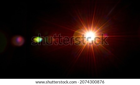 Sun flare on the black background Royalty-Free Stock Photo #2074300876