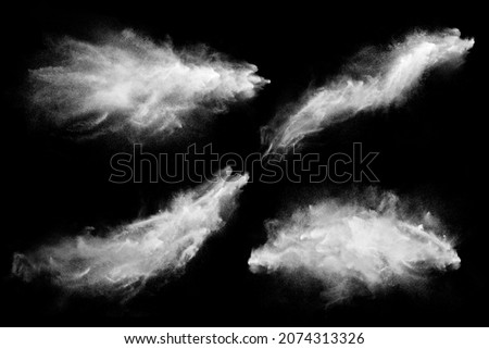 Set of dust powder splash clouds isolated on black. Flour particles exploding over dark background Royalty-Free Stock Photo #2074313326