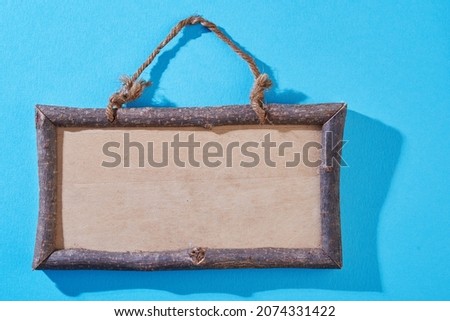wood picture frame on the blue background