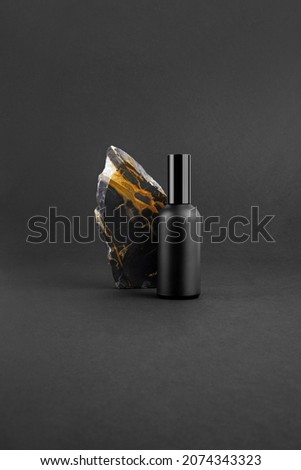 Cosmetics packaging branding mockup template black moody feel, dropper, dispenser black bottles, packaging and branding items. Blank isolated on a black background to place your design. 