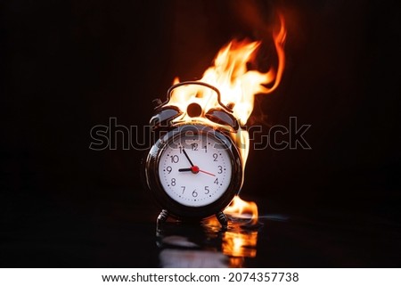 Black friday fire clock concept. time for big and hot discounts. danger background.