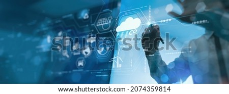 Businessman working virtual modern computer to reduce CO2 emissions carbon footprint climate change to limit global warming.Sustainable development and innovation green business concept. Royalty-Free Stock Photo #2074359814
