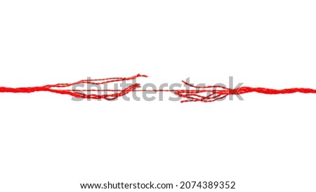 Long red thread on the verge of breaking, isolated on white background. Break the tough red rope. Rope under pressure on a white background. Red thread isolated on white background. Royalty-Free Stock Photo #2074389352