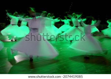 Slow shutter speed image of Whirling Dervishes performing Sema ceremony in Konya, Turkey
