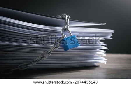 Documents locked with padlock and chains. Royalty-Free Stock Photo #2074436143