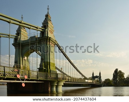 Hammersmith Bridge closed to pedestrians and river traffic. Victorian suspension bridge crossing the river Thames, London Royalty-Free Stock Photo #2074437604