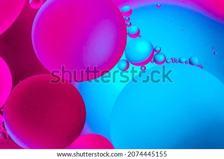 Beautiful color abstract background from mixied water and oil. Pastel colored abstraction. Blue and pink background