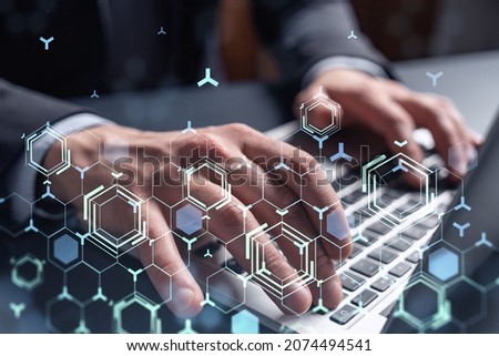 Hands typing the keyboard to create innovative software to change the world and provide a completely new service. Close up shot. Hologram tech graphs. Concept of Dev team. Formal wear.