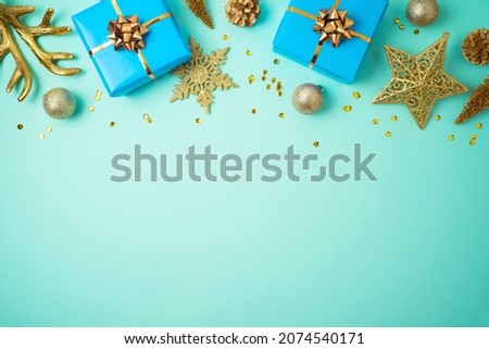 Christmas holiday background with blue gift boxes and golden decorations. New Year greeting card design. Top view with copy space