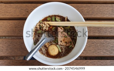 close up view. delicious Boat noodle, cheap price, pork, porkballs, from Loong Nuad thailand Royalty-Free Stock Photo #2074546999