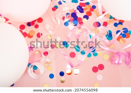 Beautiful pink background with white and rosy air balloons, confetti decorations, happy birthday and celebration concept