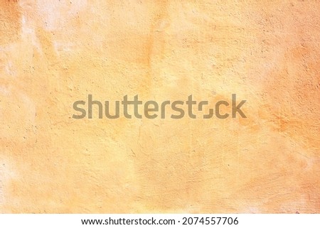 Grunge background with old stucco wall texture of yellow color Royalty-Free Stock Photo #2074557706