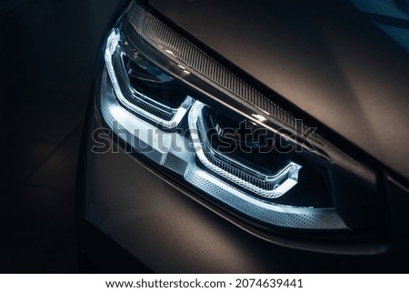 Led headlight of modern luxury car at night Royalty-Free Stock Photo #2074639441