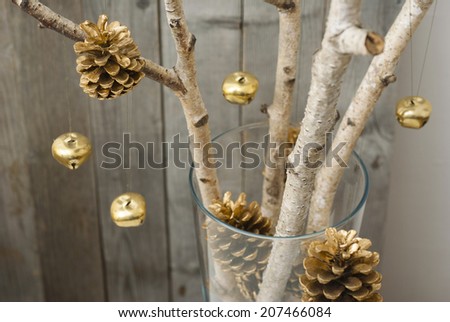 environmentalist christmas tree, golden cones hanging on white birch branches 