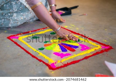 Indian pre wedding haldi ceremony colourful powder mosaic