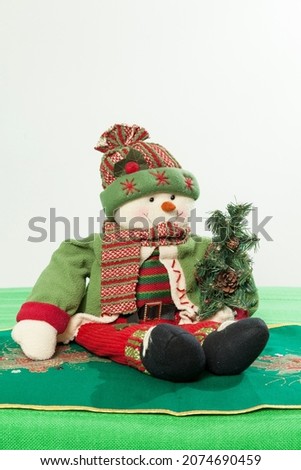Christmas Decoration - Snowman dressed in Christmas time clothes