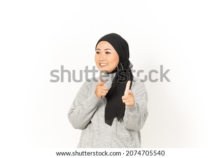 Pointing at you and smile of Beautiful Asian Woman Wearing Hijab Isolated On White Background