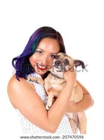 A closeup portrait picture of a Asian woman holding her dog to her face, smiling, isolated on white background. 