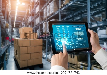 Warehouse management innovative software in computer for real time monitoring of goods package delivery . Computer screen showing smart inventory dashboard for storage and supply chain distribution . Royalty-Free Stock Photo #2074721743