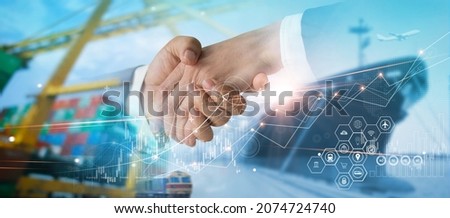 Successful logistic and transportation deal. Businessmen handshake for business partnership, import export global network distribution, shipping freight and smart delivery service. Royalty-Free Stock Photo #2074724740