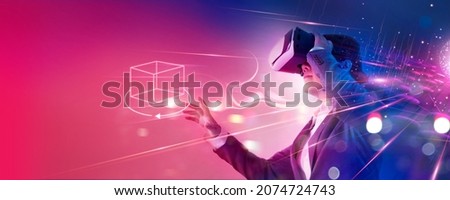 Metaverse Technology concept. Businessman use VR virtual reality goggle and experiences of metaverse virtual world for business future. Visualization, Virtual augmented reality on social network Royalty-Free Stock Photo #2074724743