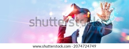 Metaverse Technology concept. Businessman use VR virtual reality goggle and experiences of metaverse virtual world for business future. Visualization, Virtual augmented reality on social network Royalty-Free Stock Photo #2074724749
