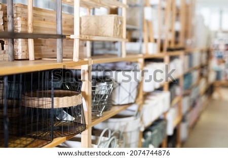 Various functional storage organizing boxes for sale in home furnishings store.. Royalty-Free Stock Photo #2074744876