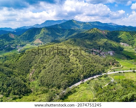 Aerial photography of magnificent scenery of blue sky and green mountains at Kunlun Pass in Nanning, Guangxi, China
