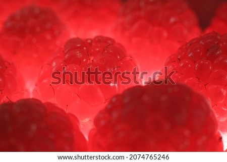 Stack of delicious cleaned raspberries. Sweet raspberries are grown in the garden