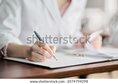 Hands of medical personnel attending the seminar Royalty-Free Stock Photo #2074794298