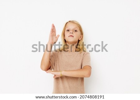emotional girl gestures with his hands posing studio