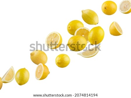 Set of perfectly retouched lemons, whole and halves isolated on white background. Lemons fly through space. Excellent retouching and full depth of field.