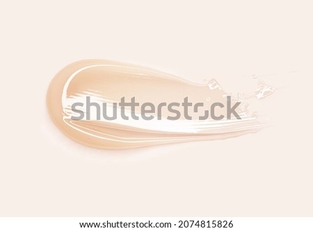 Cosmetic products creamy honey yellow texture smudge beige background Royalty-Free Stock Photo #2074815826