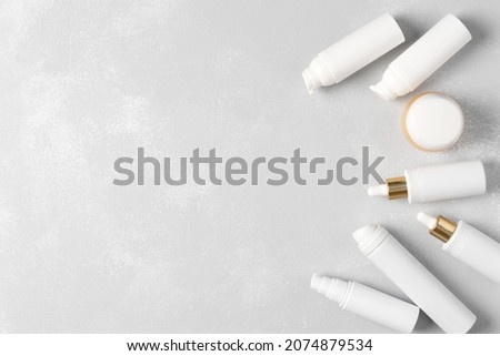 Cosmetic beauty products on shabby background. Top view, flat lay. Skin care cosmetics frame. Copy space Royalty-Free Stock Photo #2074879534