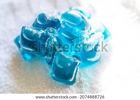 Laundry detergent in the form of blue gel balls