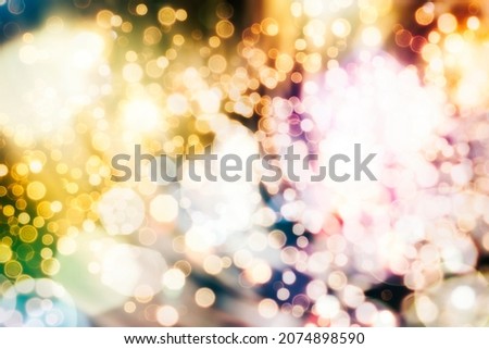 Abstract light celebration. Holiday Christmas glowing color lights with sparkles, blurred bright Christmas abstract bokeh