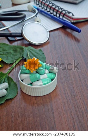 Medical desk with herbal medicine pills