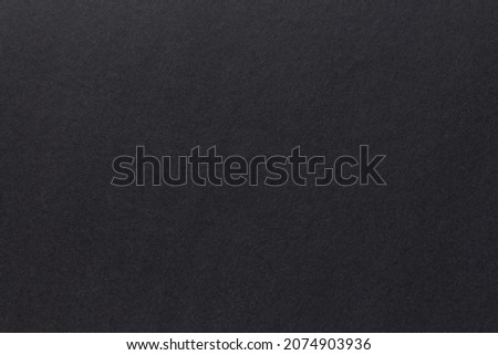 Evenly lit black background for graphics and design. Foam board texture
