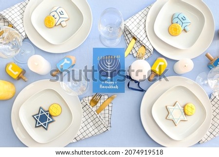 Table setting for Hanukkah celebration, top view Royalty-Free Stock Photo #2074919518