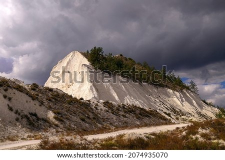 White chalk mountain, quarry against the blue sky