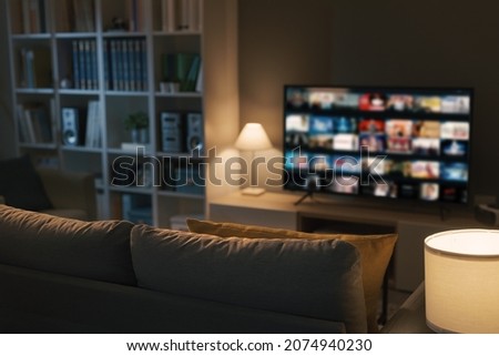 Living room interior and Video on Demand service on smart TV Royalty-Free Stock Photo #2074940230