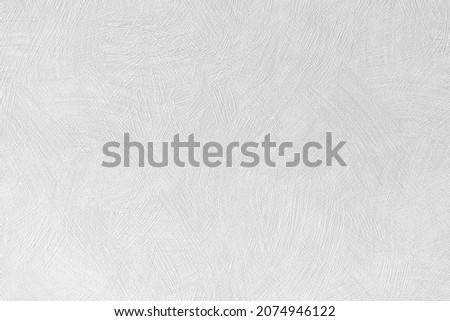 White concrete wall texture background. cement wall. plaster texture for designers. Rough empty  relief stucco wall. Royalty-Free Stock Photo #2074946122