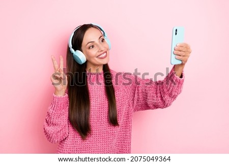 Photo of sweet young lady do selfie listen music wear pink sweater isolated on pastel color background