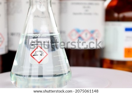 sulfuric acid in glass, chemical in the laboratory and industry Royalty-Free Stock Photo #2075061148
