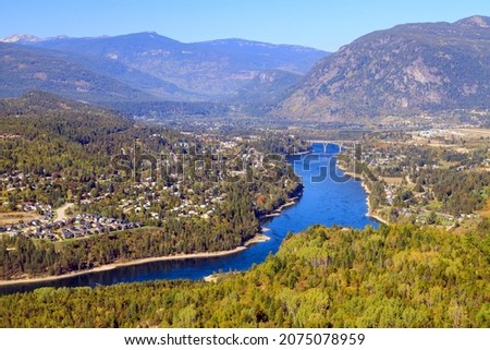 View of the Columbia River and Selkirk Mountains in Castlegar, West Kootenay, British Columbia, Canada. Royalty-Free Stock Photo #2075078959