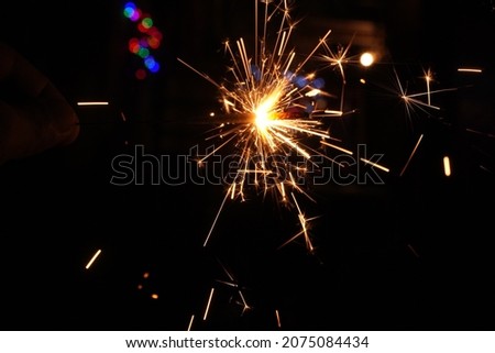 A burning fireworks during celebration festival on Black Background.