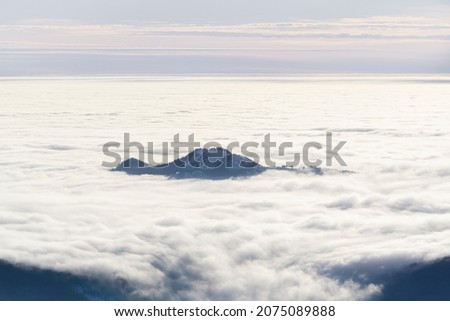 Above the Flowing Sea of Clouds