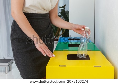 Waste separation and recycling in business office, a midsection. Royalty-Free Stock Photo #2075103274