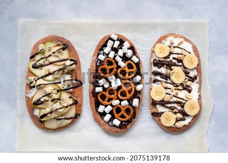 Dessert with the original name "Beaver Tails" comes with different fillings. Also, this dessert is called the tail of beauty, as it is often decorated with various icing sprinkles. Royalty-Free Stock Photo #2075139178